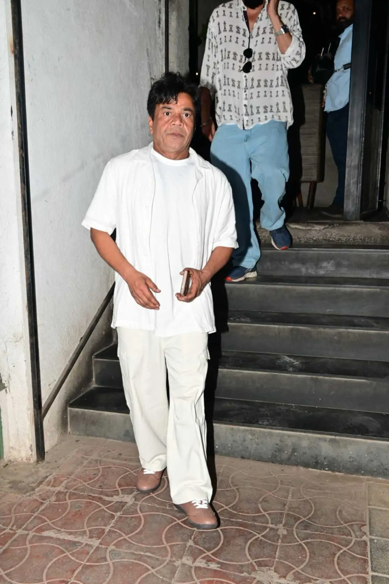 Rajpal Yadav kept it simple and stylish as he attended Ashoke Pandit&rsquo;s birthday celebration. The actor was seen wearing a crisp white T-shirt paired with matching white pants.